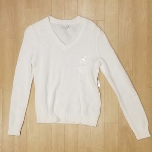 White long-sleeve sweater.